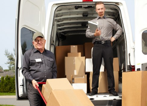 Loading furniture and boxes into a van for a West Hendon move