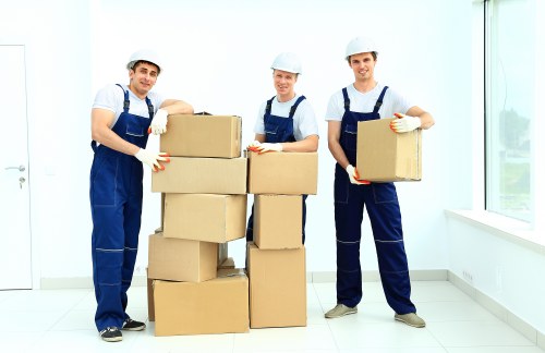 Local moving van helping with boxes and household items in West Hendon