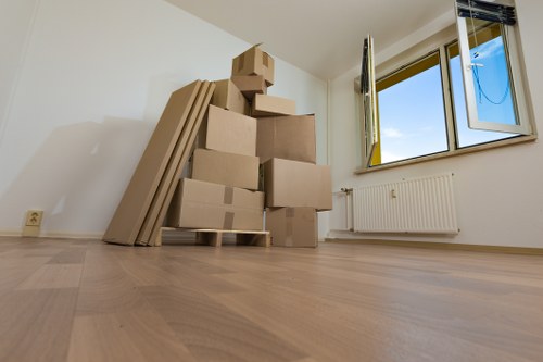 Loading furniture and boxes into a van for a West Hendon moving service