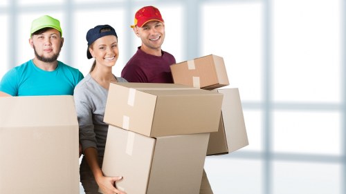 Local movers loading household items for transport in West Hendon