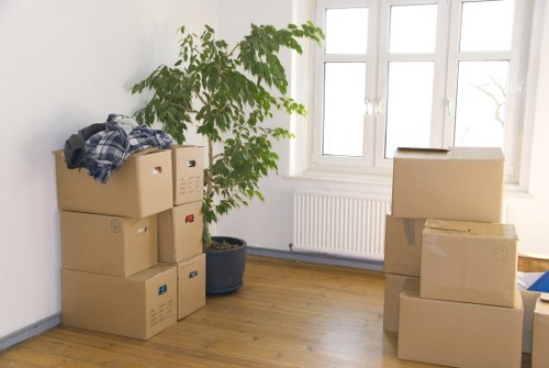 Packed moving boxes ready for a West Hendon home relocation