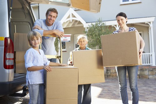 Movers handling household items and furniture carefully