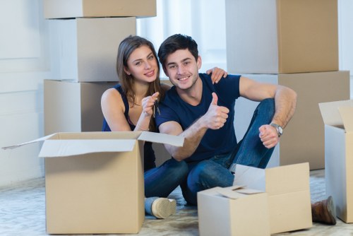 Packed boxes and furniture ready for a house move in West Hendon