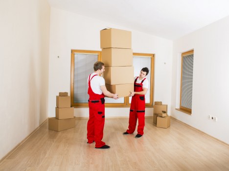 Commercial relocation setup showing workspace items ready for transport in West Hendon