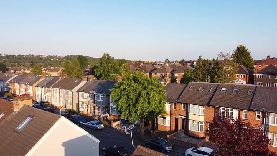 A black and white aerial photograph of a residential neighbourhood in West Hendon, showing rows of detached and terraced houses with pitched roofs, some with small front gardens. Streets are arranged 